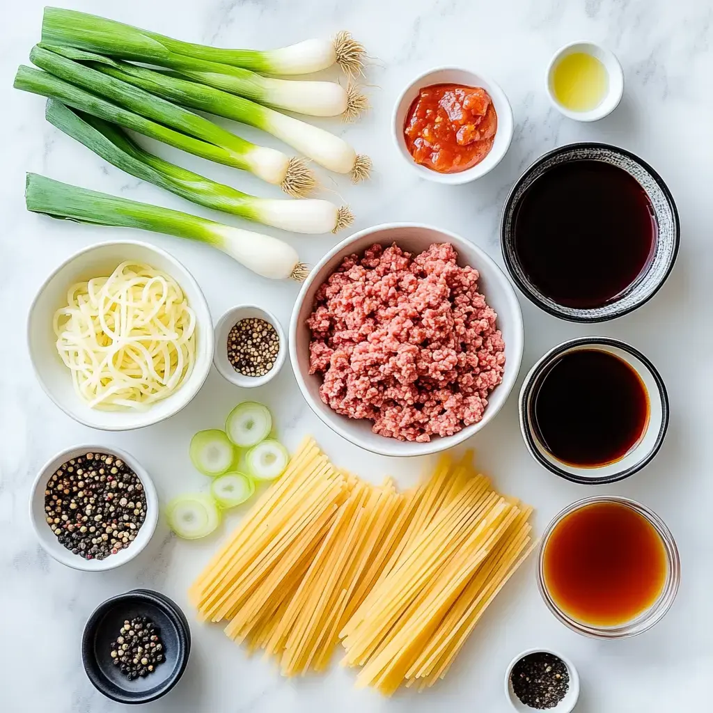 You’ll see all the cooked-together goodies—meat, onions, dry noodles, bottles of sauces, and little jars of spices all set out on a marble countertop.